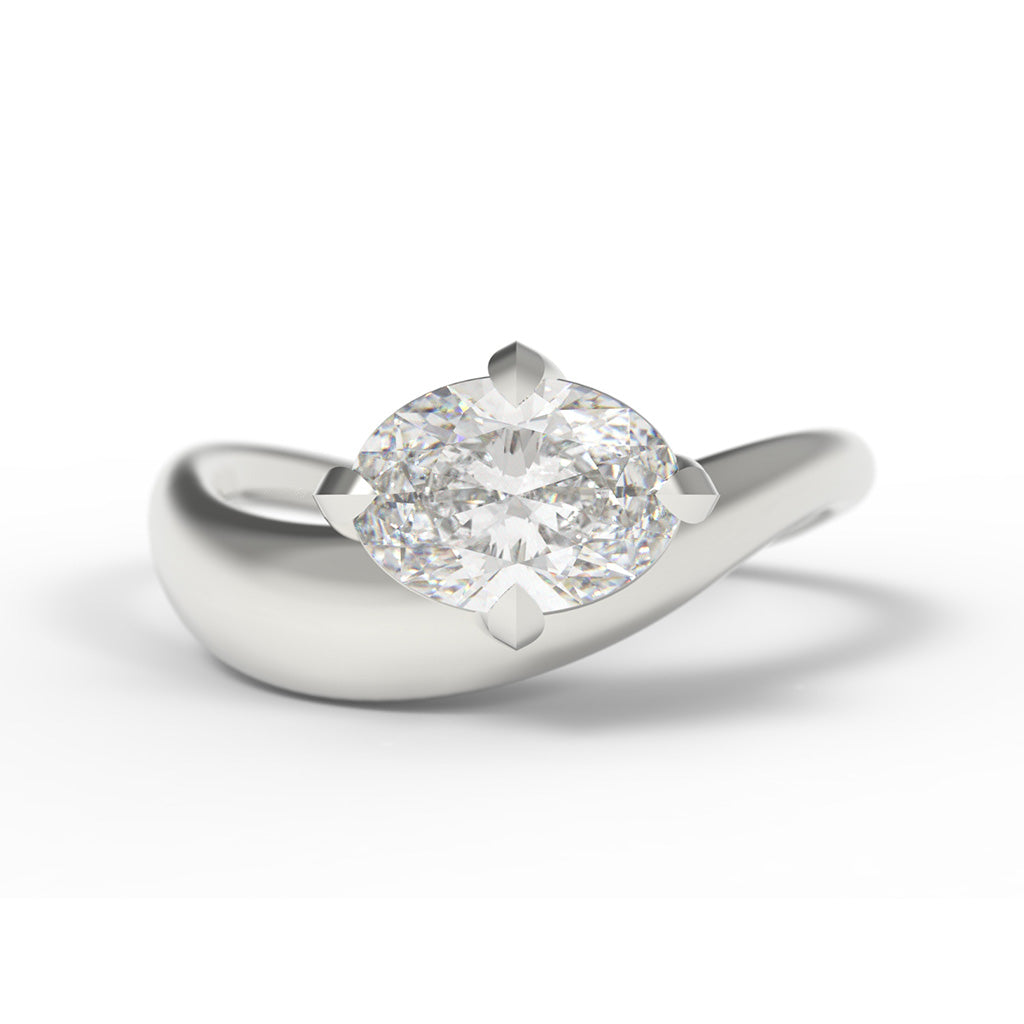 A unique Large Oval Diamond Ring, with a Wide White Gold Band, with Sculptural Wave details and an East-West setting.