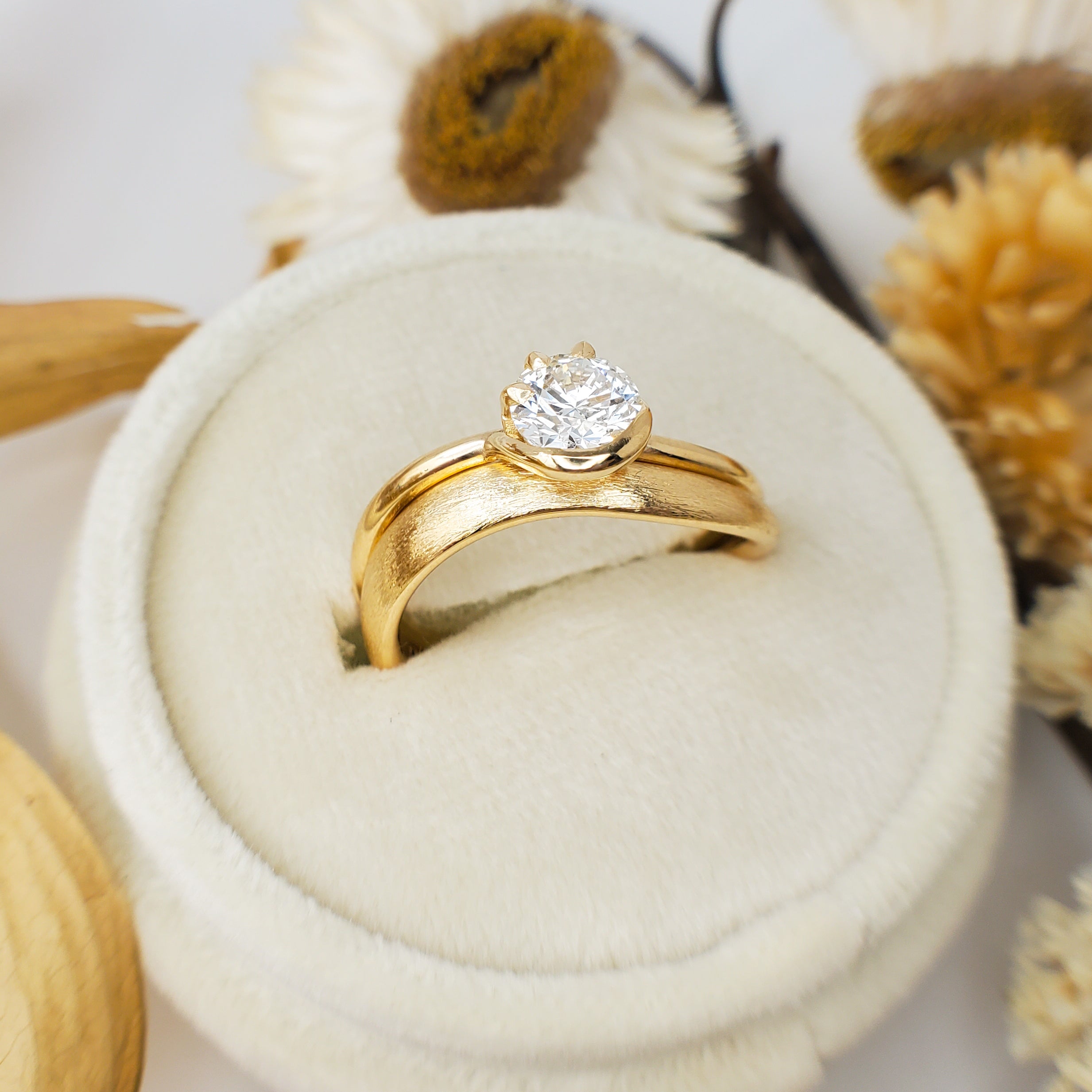 1ct Diamond Ring with Half Bezel Setting with 3 Claw Detting on Wave Band in 18K Yellow Gold.