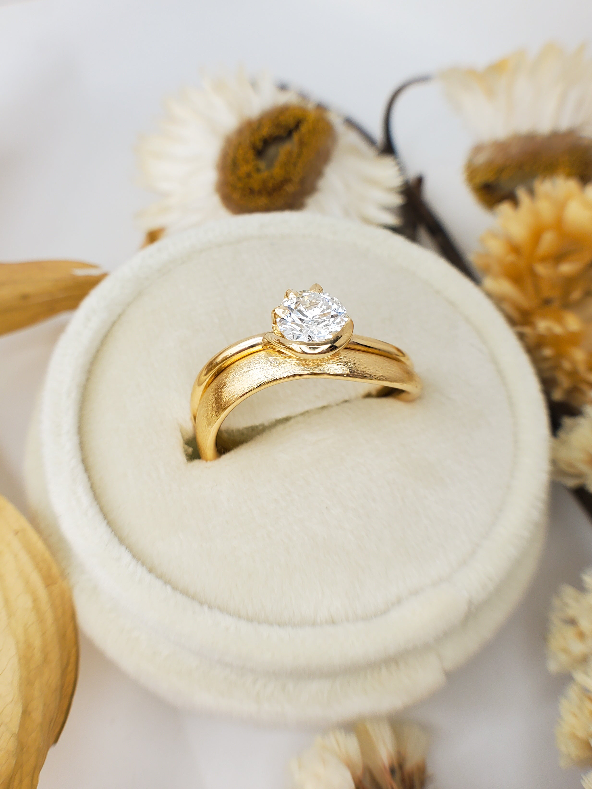 1ct Diamond Ring with Half Bezel Setting with 3 Claw Detting on Wave Band in 18K Yellow Gold.