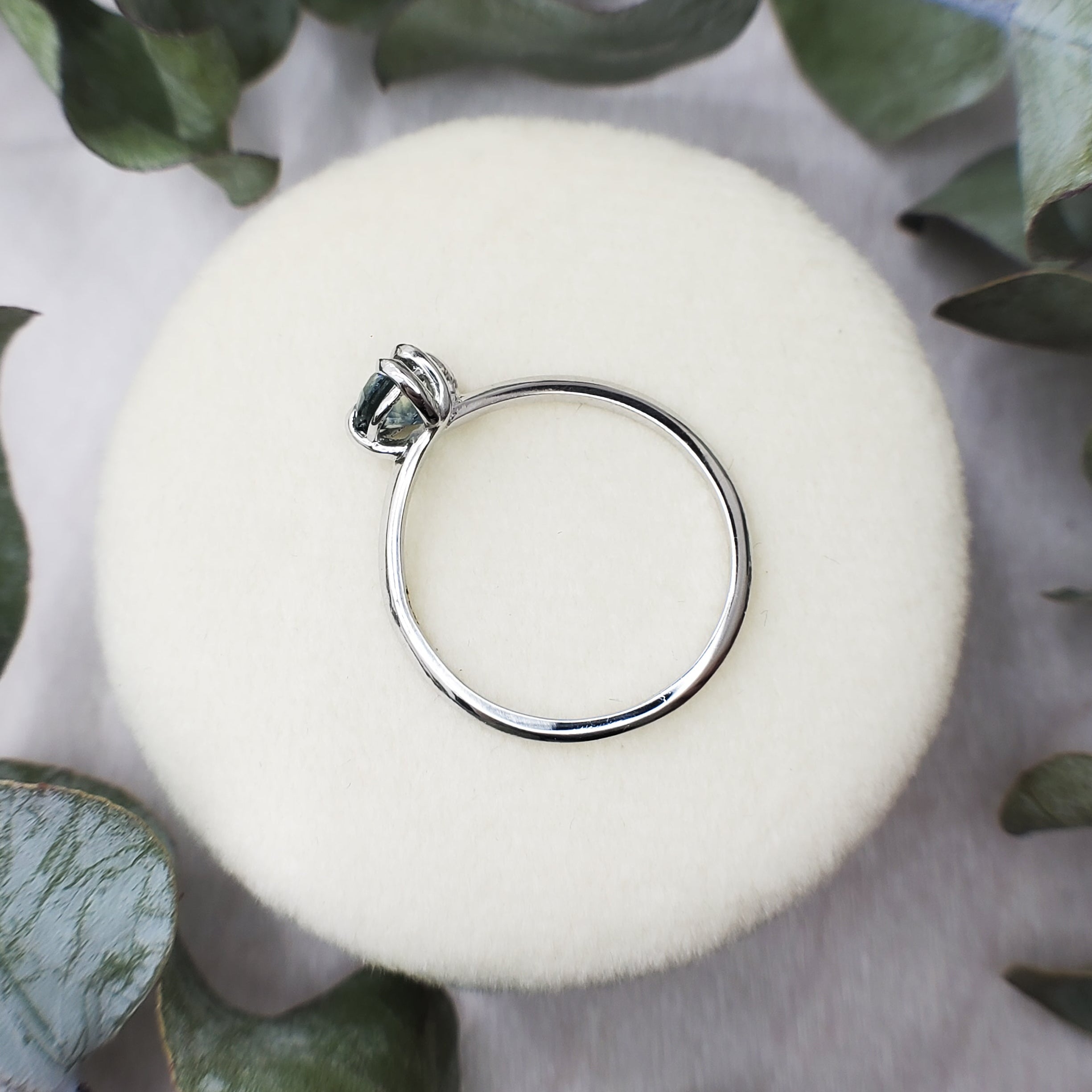 Platinum and sapphire engagement ring. Low profile design with nature inspiration. 