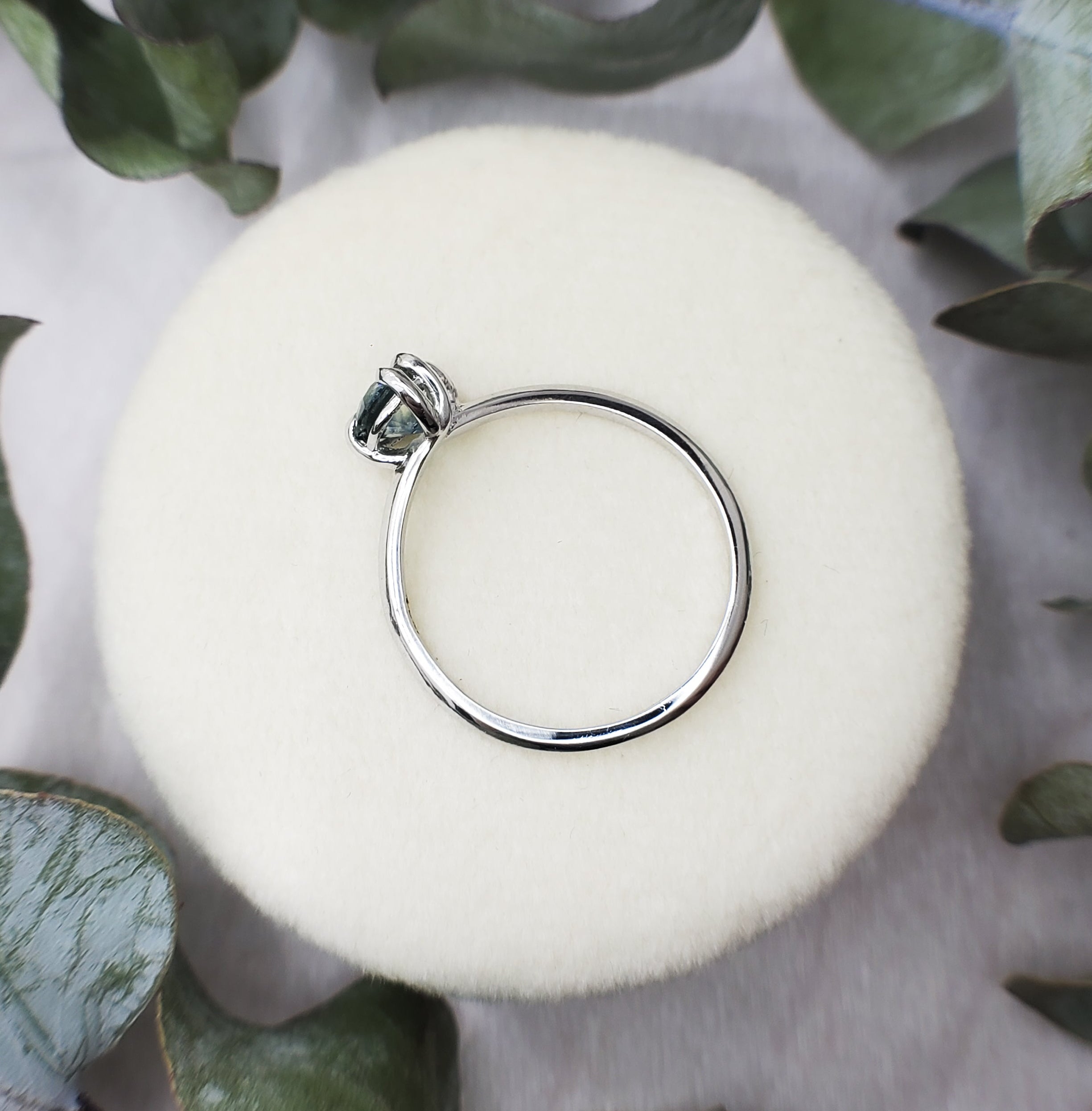 Platinum and sapphire engagement ring. Low profile design with nature inspiration. 