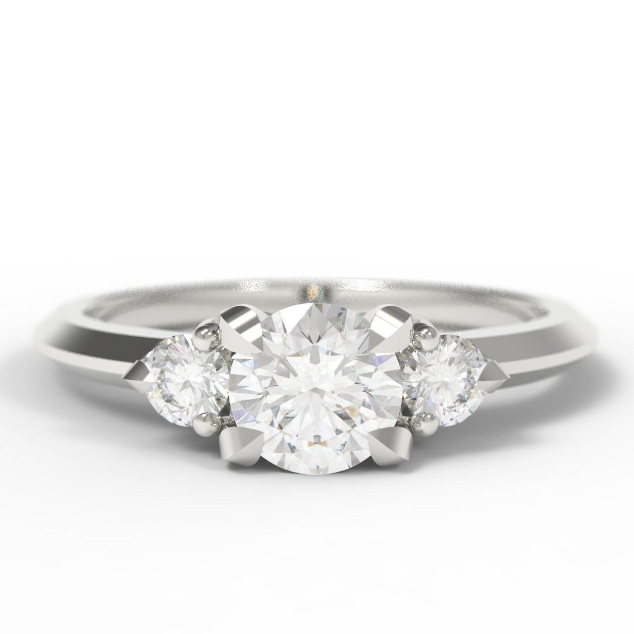 A three-stone diamond ring with a round center diamond and two marquise-cut side diamonds on a polished silver-colored band, set against a plain white background.