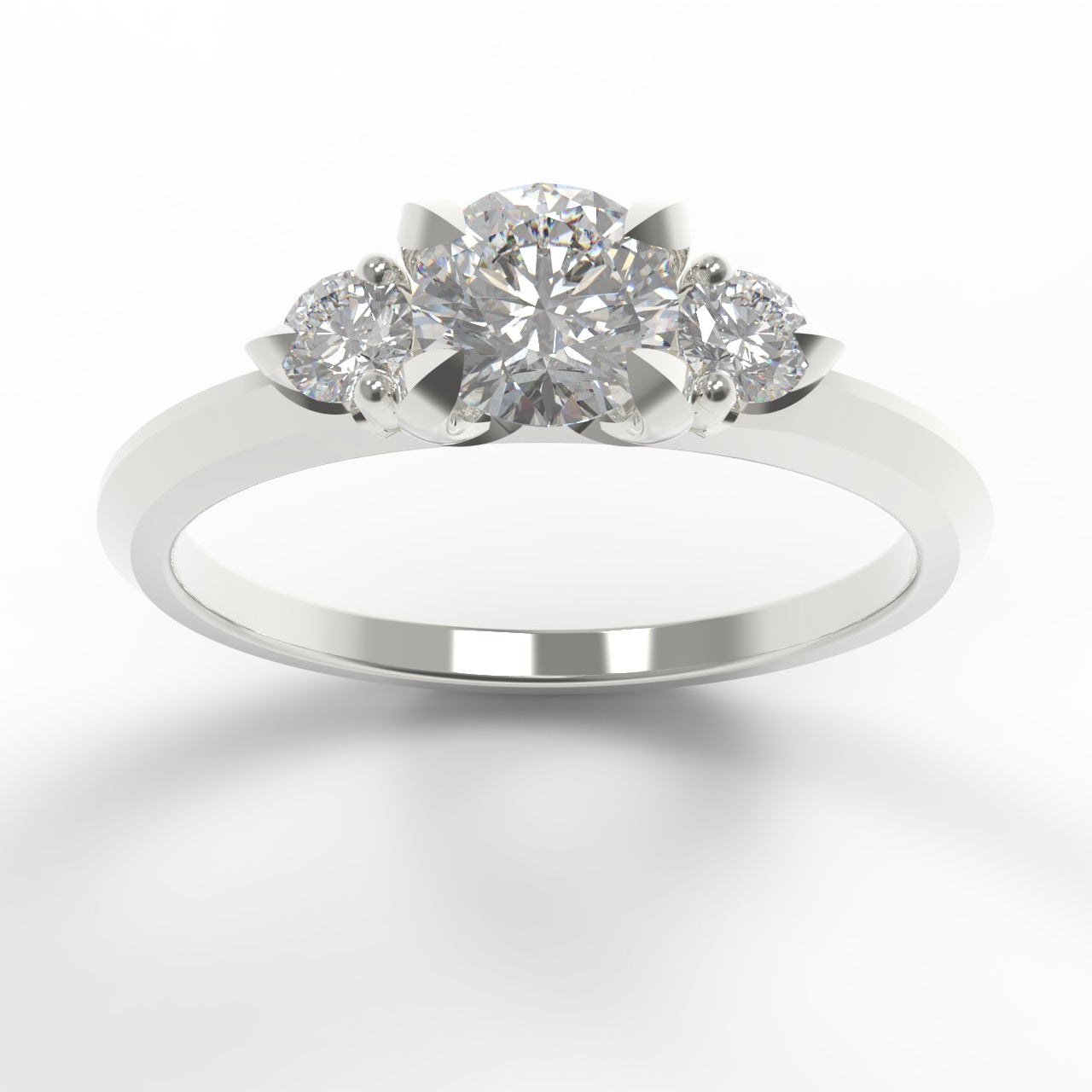 A three-stone diamond ring in a polished white gold, featuring a central round lab-grown moissanite flanked by two smaller round lab-grown moissanite , set against a clean white background.