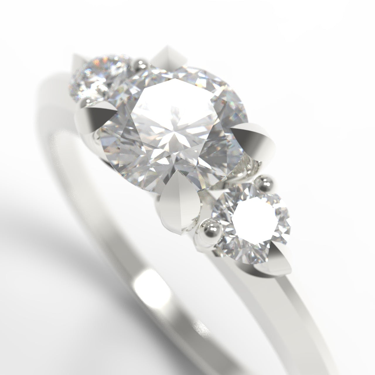 A close-up shot of a white gold three-stone diamond ring on a clean white background.