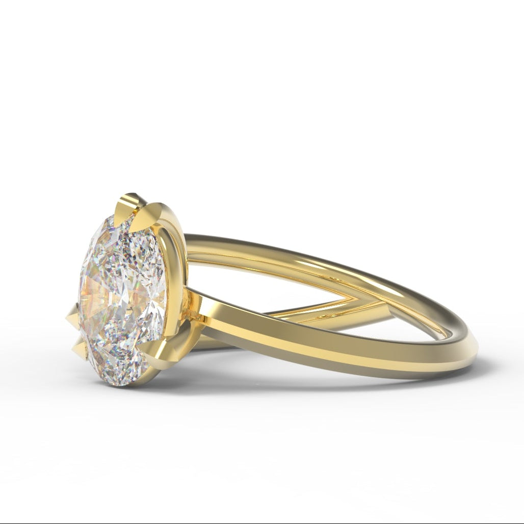 Gold Engagement Ring with 2 carat oval-shaped diamond with leaf setting and branch details.