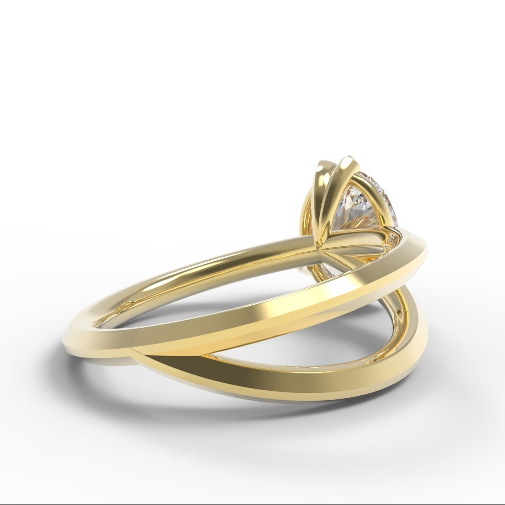 Gold Engagement Ring with 2 carat oval-shaped diamond with leaf setting and branch details.