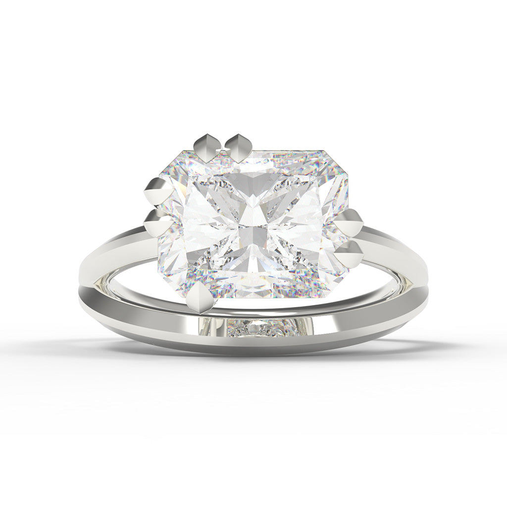 White gold ring with a large radiant cut diamond with split band and leaf shaped claw setting