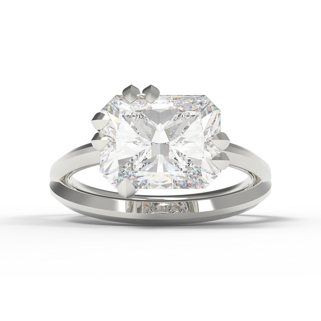White gold engagement ring with a large radiant cut diamond with split band and leaf shaped claw setting