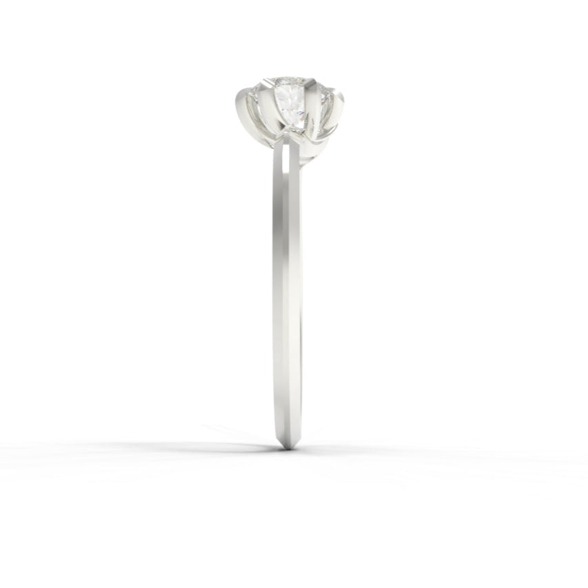 White gold ring with a diamond on a white background
