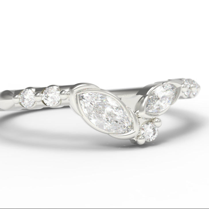 14K White Gold ring with marquise shaped diamonds on a white background