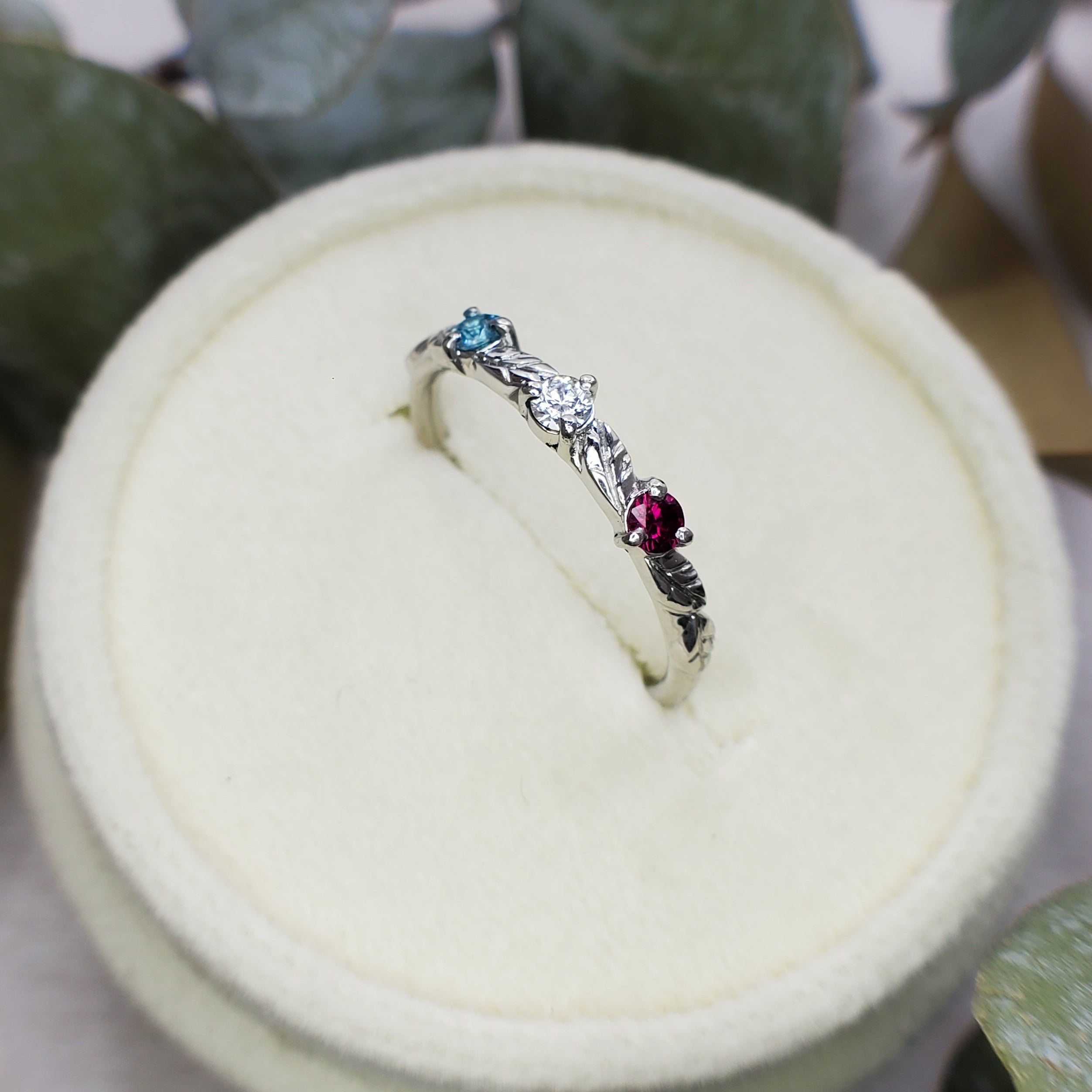 Platinum ring with engraved leaves and gemstones, by Chayle Jewellery Studio.