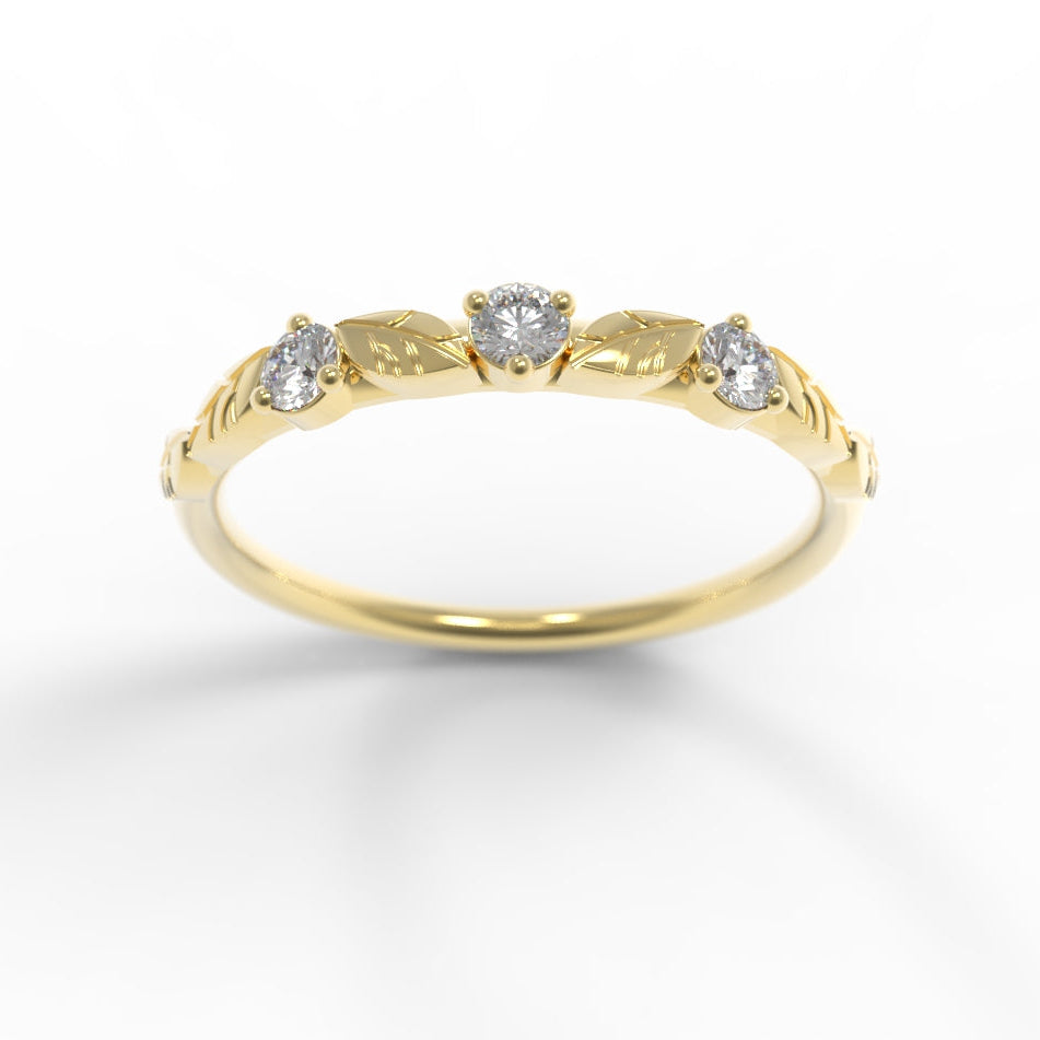 Hand engraved Leaves on Gold ring with three diamonds on a white background by Chayle Jewellery Studio.