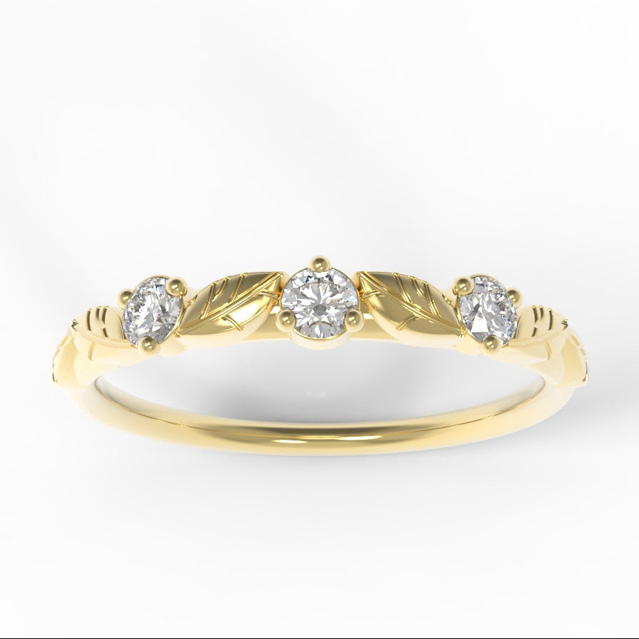 Hand engraved leaves on a gold ring with three diamonds on a white background by Chayle Jewellery Studio.