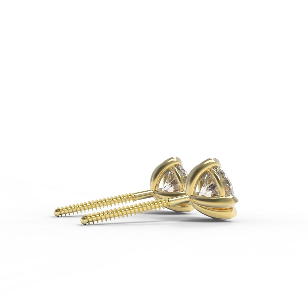 Canadian Diamond and Gold stud earrings on a white background