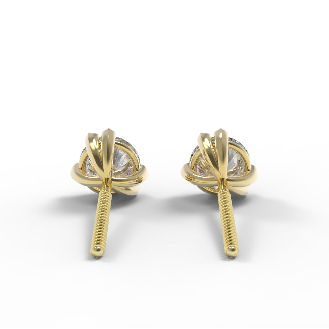 Canadian Diamond and Gold stud earrings on a white background