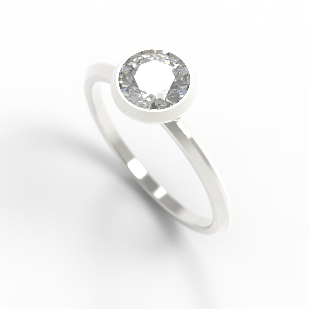 A minimalist silver ring featuring a bezel-set round clear gemstone, shown on a clean white background with a soft shadow.