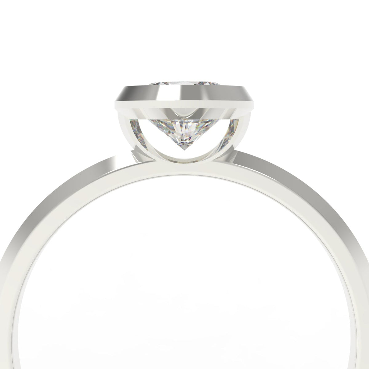 A close-up studio shot of a white gold solitaire ring with a clear gemstone in a prong setting, shown against a plain white background.