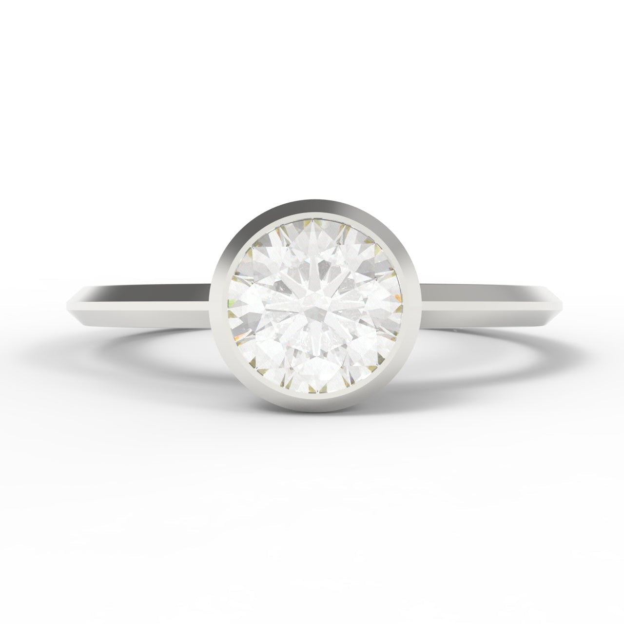 A classic solitaire engagement ring featuring a round brilliant-cut diamond set in a polished white gold band, shown on a clean white background.