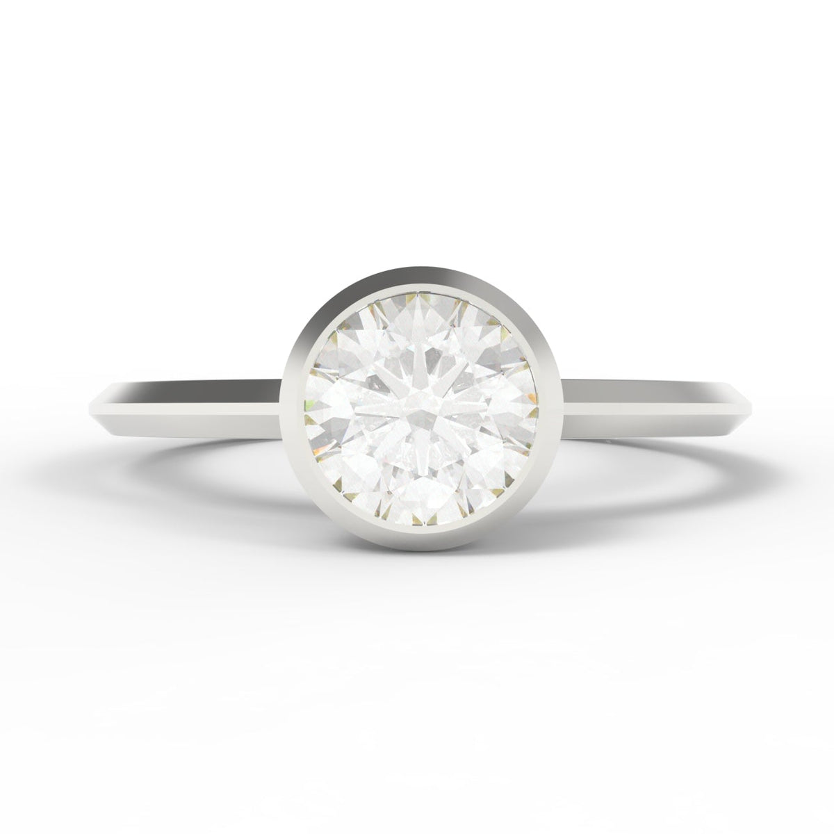 A classic solitaire engagement ring featuring a round brilliant-cut diamond set in a polished white gold band, shown on a clean white background.