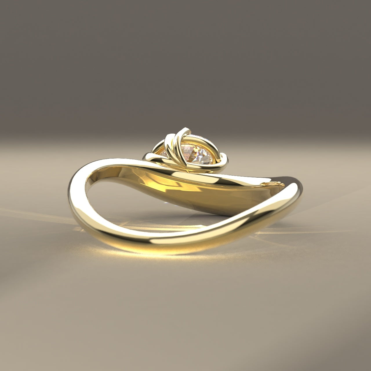 Ethically made Gold ring with a oval Canadian diamond on a light beige surface in reflective spot lighting.