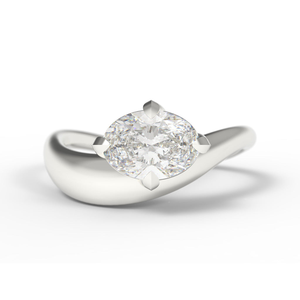 A Large Oval Diamond Ring, with a Wide White Gold Band, with Sculptural Wave details and an East-West setting.