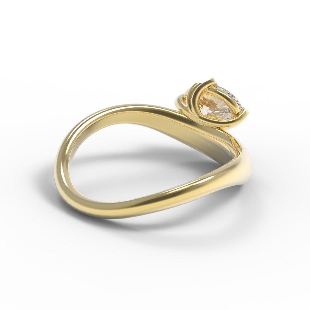 Hidden details or a Large Oval Diamond Ring, with a Wide Yellow Gold Band, with Sculptural Wave details and an East-West setting.